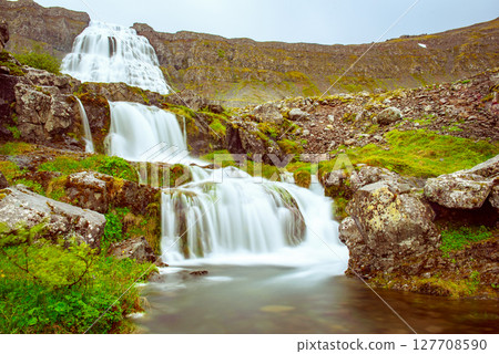 Dynjandi is one the most famous waterfall of the West Fjords of Iceland at summer 127708590
