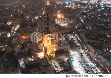Aerial night View of Tallinn in winter, roofs are covered with snow, Christmas mood Aerial night View of Tallinn in winter, roofs are covered with snow, Christmas mood 127708633