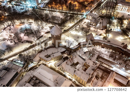 Aerial night View of Tallinn in winter, roofs are covered with snow, Christmas mood Aerial night View of Tallinn in winter, roofs are covered with snow, Christmas mood 127708642