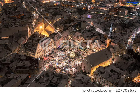 Aerial night View of Tallinn with the Town Hall Square in winter, roofs with snow, Christmas mood Aerial night View of Tallinn with the Town Hall Square in winter, roofs with snow, Christmas mood 127708653