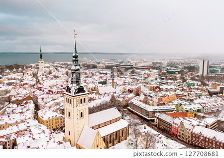 Aerial View of Tallinn in winter, roofs are covered with snow, Christmas mood Aerial View of Tallinn in winter, roofs are covered with snow, Christmas mood 127708681