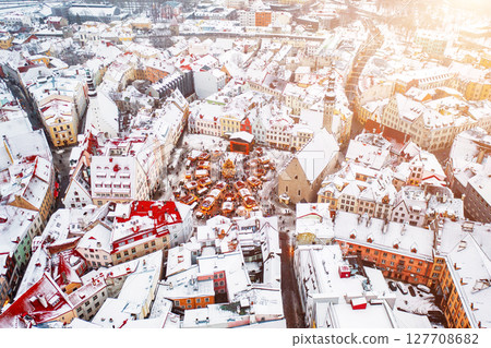 Aerial View of Tallinn with the Town Hall Square in winter, roofs with snow, Christmas mood Aerial View of Tallinn with the Town Hall Square in winter, roofs with snow, Christmas mood 127708682