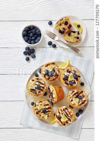 tasty blueberry muffins with lemon chocolate glaze tasty blueberry muffins with lemon chocolate glaze 127709270