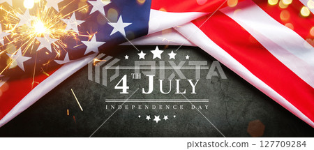 vintage America flag on black chalkboard with text 4th July Independence Day, decorated with sparkler light bokeh. flag American background banner for USA Independence Day nation holiday celebration vintage America flag on black chalkboard with text 4th July Independence Day, decorated with sparkler light bokeh. flag American background banner for USA Independence Day nation holiday celebration 127709284