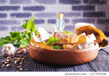 fried cutlets on brown bowl fried cutlets on brown bowl 127709296