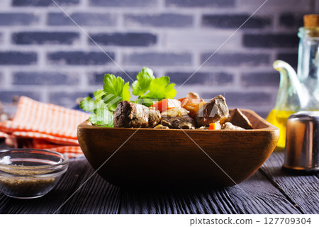 Fried chicken liver with onions and carrots 127709304