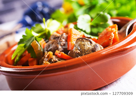 Fried chicken liver with onions and carrots Fried chicken liver with onions and carrots 127709309