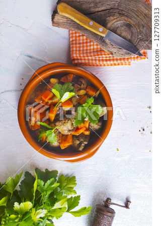 Fried chicken liver with onions and carrots 127709313