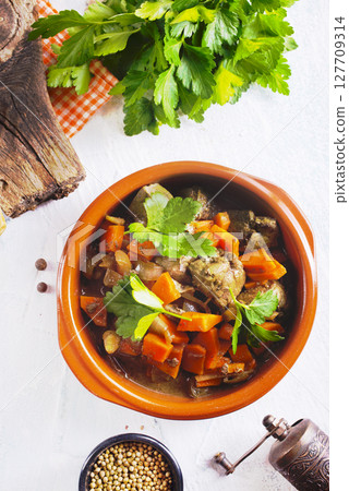 Fried chicken liver with onions and carrots 127709314