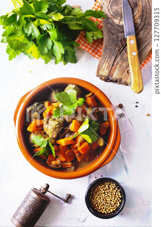 Fried chicken liver with onions and carrots Fried chicken liver with onions and carrots 127709315
