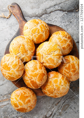 Pineapple buns Bo Lo Bao is a kind of sweet bun from Hong Kong the name refers to the look of the characteristic topping closeup on the table. Vertical top view Pineapple buns Bo Lo Bao is a kind of sweet bun from Hong Kong the name refers to the look of the characteristic topping closeup on the table. Vertical top view 127709504