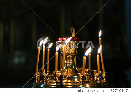 Candles burning in an Orthodox church. 127710147
