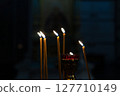 Candles burning in an Orthodox church. 127710149