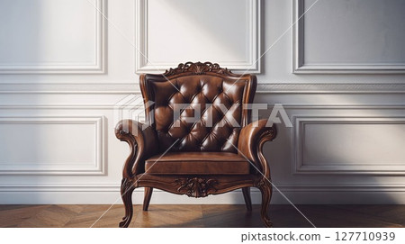 A brown leather chair is placed prominently in front of a white wall A brown leather chair is placed prominently in front of a white wall 127710939