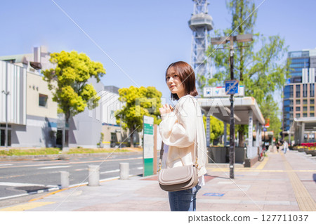 A young lady walking in the city A young lady walking in the city 127711037