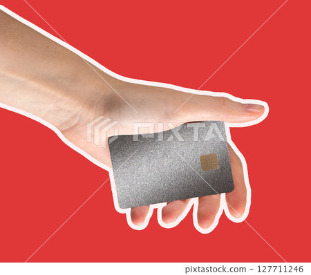 Bank card in hand, held securely by cardholder for online payment. Offering a cashless transaction Bank card in hand, held securely by cardholder for online payment. Offering a cashless transaction 127711246