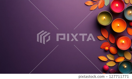 Colorful candles arranged with autumn leaves on a purple background create a warm atmosphere ideal for seasonal celebrations or relaxation 127711771