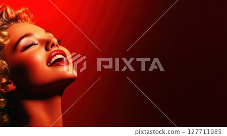 Woman with curly hair smiles brightly against a vibrant red backdrop showcasing elegance and joy during a photoshoot 127711985
