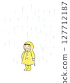 A child wearing a yellow raincoat in the rain 127712187