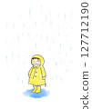 A child wearing a yellow raincoat in the rain 127712190