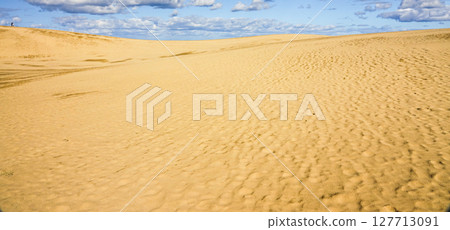 A simple landscape of blue sky, clouds and Tottori sand dunes A simple landscape of blue sky, clouds and Tottori sand dunes 127713091