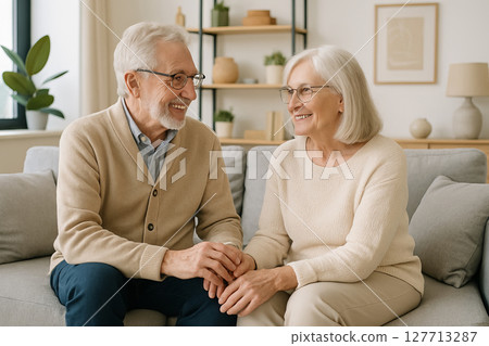 Elderly couple engaging in heartfelt conversation while seated together at home. concept of companionship, senior bonding, meaningful relationships in later life 127713287