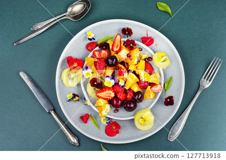 Plate of fresh fruit salad, healthy summer meal. 127713918