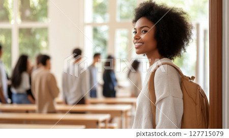Young african american woman entering classroom doorway, higher education theme Young african american woman entering classroom doorway, higher education theme 127715079