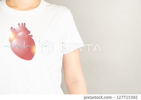 Heart organ anatomy with electrocardiogram (ECG) on woman body. Cardiological and world heart day concept. 127715392