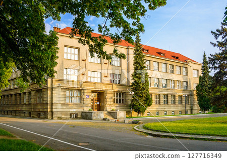 uzhhorod, ukraine - 03 jun 2012: medical faculty building of national university. scenic urban landscape located near embankment of independence (linden alley) in morning light 127716349