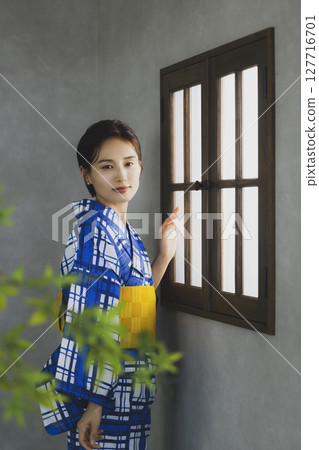A woman in a yukata by the window A woman in a yukata by the window 127716701