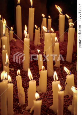 Candles burning on the dirt floor Candles burning on the dirt floor 127717097