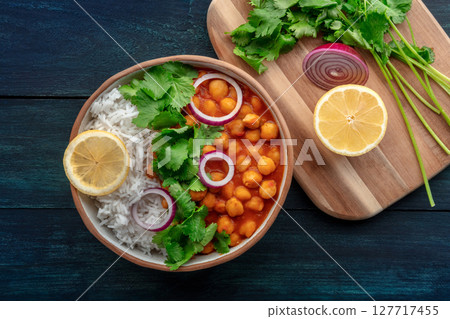Chana masala, chickpea curry, traditional Indian dish, overhead flat lay shot 127717455