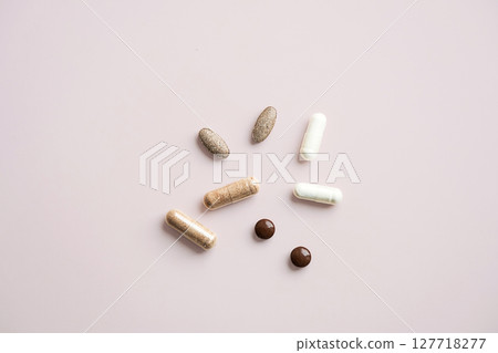 Various Pills and Capsules on Light Background. Daily Vitamins and Supplements for Healthy Lifestyle. Various Pills and Capsules on Light Background. Daily Vitamins and Supplements for Healthy Lifestyle. 127718277
