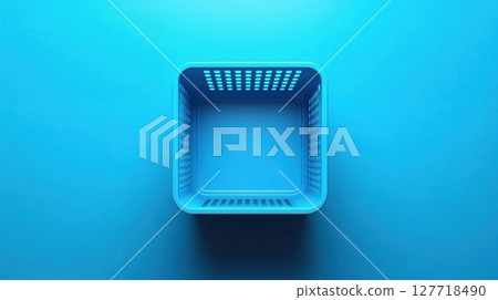 Empty blue plastic basket photographed from above on matching background. Minimal still life composition with geometric shapes and shadows 127718490