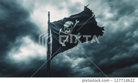 A tattered pirate flag with a skull and crossbones flutters against a stormy sky, symbolizing danger and adventure on the high seas 127718622