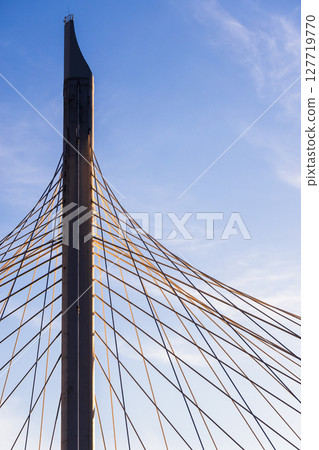 A striking image showcasing the architectural design of a suspension bridge A striking image showcasing the architectural design of a suspension bridge 127719770