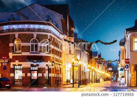 Parnu, Estonia. Night View Of Famous Ruutli Street With Old Buildings, Restaurants, Cafe, Hotels And Shops In Festive Evening Night Christmas Xmas New Year Illuminations Parnu, Estonia. Night View Of Famous Ruutli Street With Old Buildings, Restaurants, Cafe, Hotels And Shops In Festive Evening Night Christmas Xmas New Year Illuminations 127719988