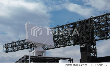 Advanced military radar system positioned in a conflict area to monitor enemy movements and provide real-time data for tactical operations. 127720507