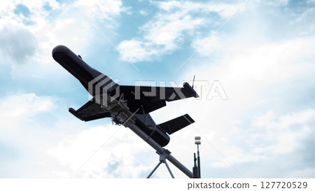 Military drones are launched into the sky for reconnaissance and targeted missions during ongoing conflicts, showcasing modern warfare tactics and technologies. Military drones are launched into the sky for reconnaissance and targeted missions during ongoing conflicts, showcasing modern warfare tactics and technologies. 127720529
