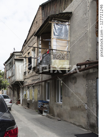 old abandoned building, the building is in a state of disrepair 127721246