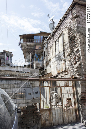 old abandoned building, the building is in a state of disrepair 127721264