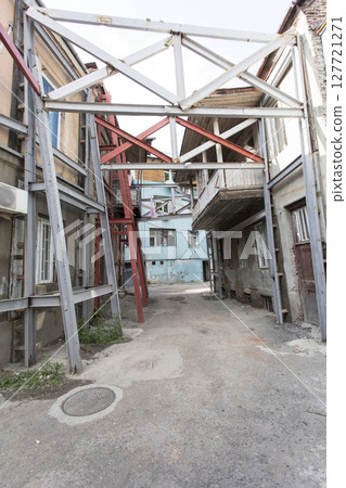 old abandoned building, the building is in a state of disrepair 127721271