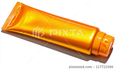 An orange tube of sunscreen (SPF50) is placed on a white background 127722080