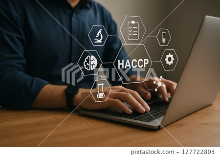 Food safety professional using laptop with HACCP icons representing scientific tools and digital analysis for critical control in food processing 127722803