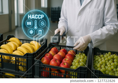 Scientist scanning bananas, apples and grapes in plastic crates during food safety inspection under HACCP guidelines with digital icons in modern facility 127722826