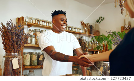 The african american seller of spice shop warmly The african american seller of spice shop warmly 127723427