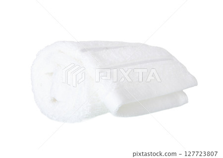 Rolled white face towel isolated on white 127723807