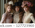 Elegant models showcase vintage fashion from the 19th century in a sophisticated indoor setting during a stylish photoshoot 127723960