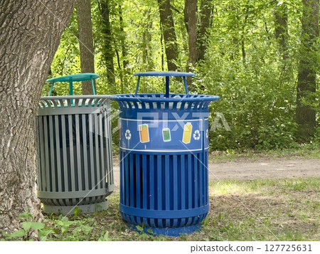 waste bins for separate waste collection in the park 127725631